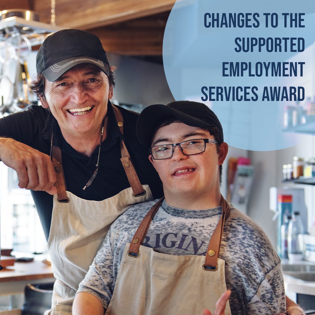 man and disabled employee smiling