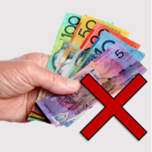 A hand holding money with a red cross beside it